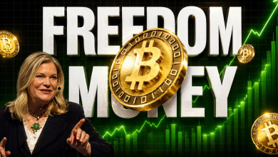 Senator Cynthia Lummis speaking in front of the words "FREEDOM MONEY" and floating Bitcoin coins with a bullish green chart.