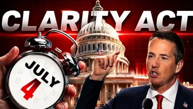 A political figure speaking in front of the US Capitol Building with "CLARITY ACT" in large letters and a hand holding an alarm clock set to July 4.