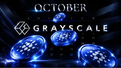 Multiple glowing blue Cardano (ADA) coins floating in front of a digital calendar marked "OCTOBER" and the official Grayscale logo on a dark, high-tech background.