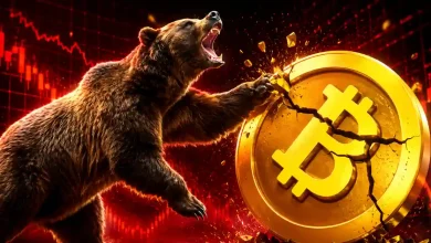 A large grizzly bear roaring and smashing a gold Bitcoin coin in half with its paw, set against a red bearish candlestick trading chart background.