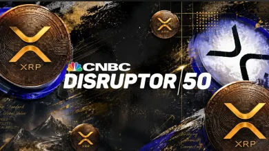 A 3D silver and blue XRP token logo coin floating over a modern tech background featuring a prominent blue billboard displaying the text Rank 16.
