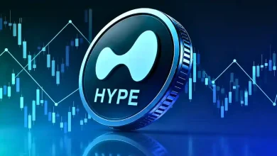Large blue and metallic Hyperliquid HYPE token standing upright in front of a blue digital candlestick chart background.