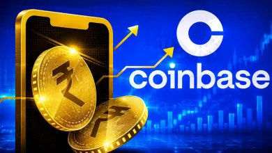 Golden digital rupee coins emerging from a smartphone next to the Coinbase logo against a blue market chart.