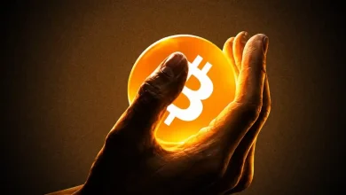 A large gold Bitcoin coin positioned next to a rising green price chart.