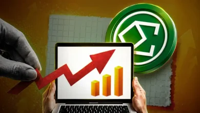 A silver Ethena ENA coin positioned next to a rising green market chart.