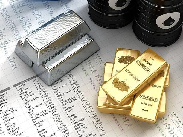 Silver and Gold bars placed on paper