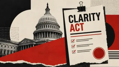 Clipboard with CLARITY Act text next to the US Capitol building.