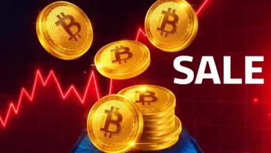 Golden Bitcoin coins falling onto a stack next to the text "SALE" over a red market chart line.