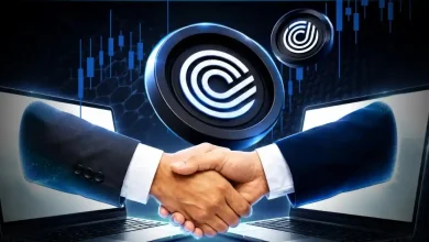 Shaking hands from laptops with ONDO coin.