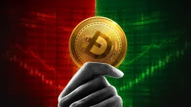 Hand holding a golden Dogecoin against a red and green chart.