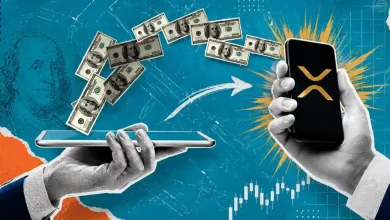 Money transferring digitally between two smartphones with the XRP logo displayed.