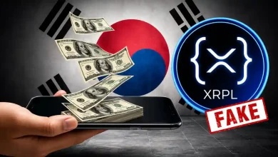 Hand holding a phone with cash flying out near an XRPL logo labeled FAKE.