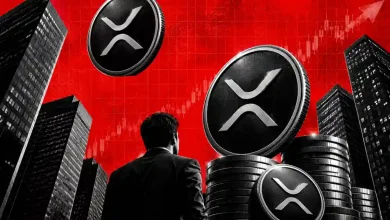 Person looking at XRP coins stacked among city skyscrapers against red chart.