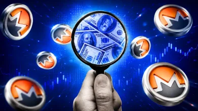 Magnifying glass over US dollars surrounded by Monero coins.