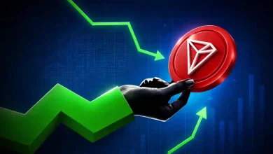 Hand holding red TRON coin surrounded by rising green chart arrows.