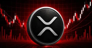 Silver XRP coin centered on red candlestick chart background.