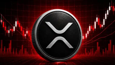 Silver XRP coin centered on red candlestick chart background.