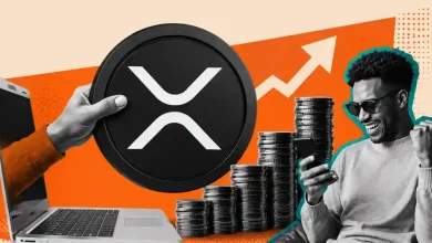 Hand emerging from laptop with XRP coin beside stacked coins and celebrating trader.