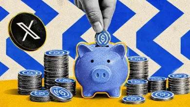 Hand inserting a USDC coin into a piggy bank alongside XRP tokens.