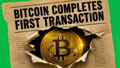Newspaper snippet reading BITCOIN COMPLETES FIRST TRANSACTION revealing a golden Bitcoin.
