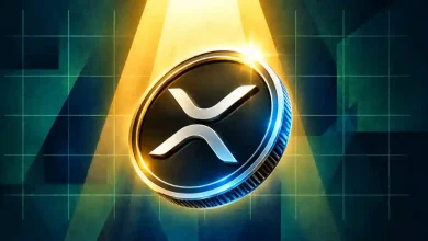 XRP coin glowing in golden spotlight over grid background.