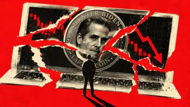 Person looking at Hunter Biden Laptop Coin on torn laptop display with price chart