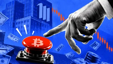 Hand reaching to press red Bitcoin emergency button beside falling red charts