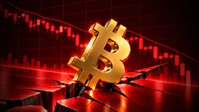 Gold Bitcoin symbol in ground crack against red falling candlestick chart