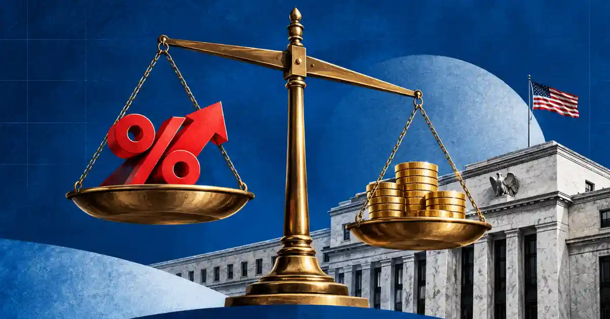 Golden balance scale weighing a red percent arrow against gold coins in front of the US Federal Reserve building